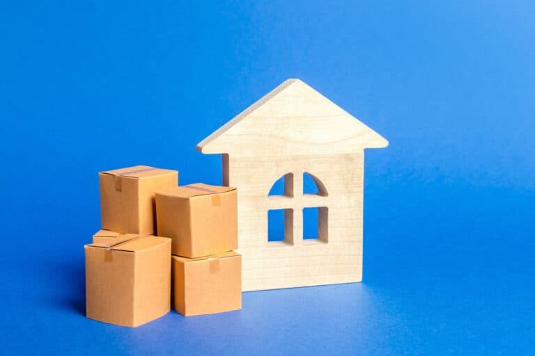An illustration of a house with cardboard boxes in the concept of home removal