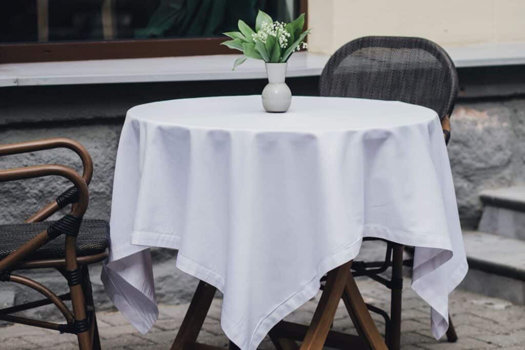 A table and chairs of a street bistro